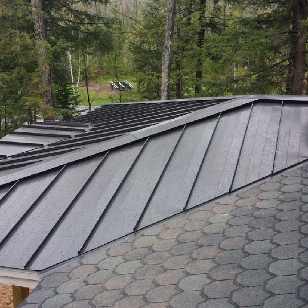 An example of metal panels and asphalt roofing