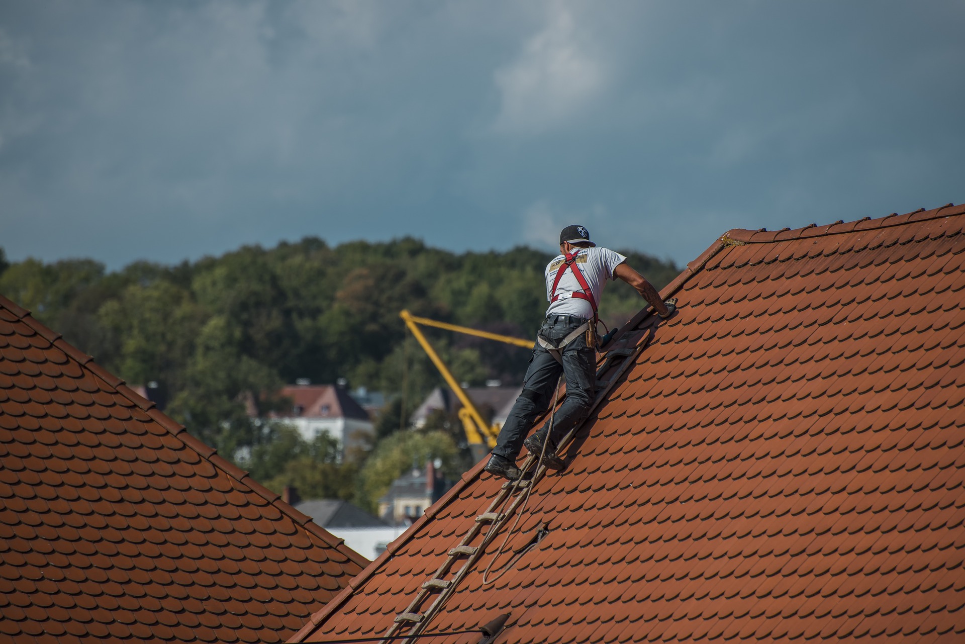 roofer installing shingles