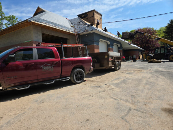 Team Norm's working on a roof.