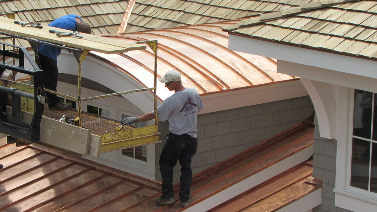 Norm's Roofing's Northern Michigan crew completing a gorgeous copper roof.