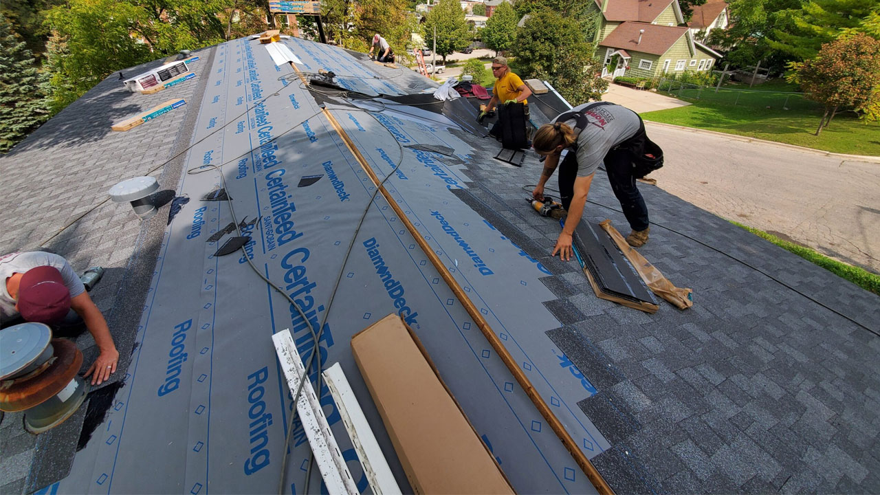 Norm's Roofing team installing a roof