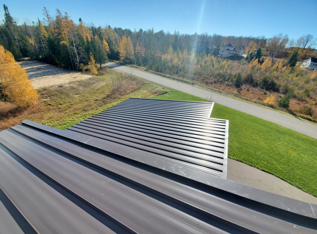 Metal roofing panels gleaming in the Michigan sun