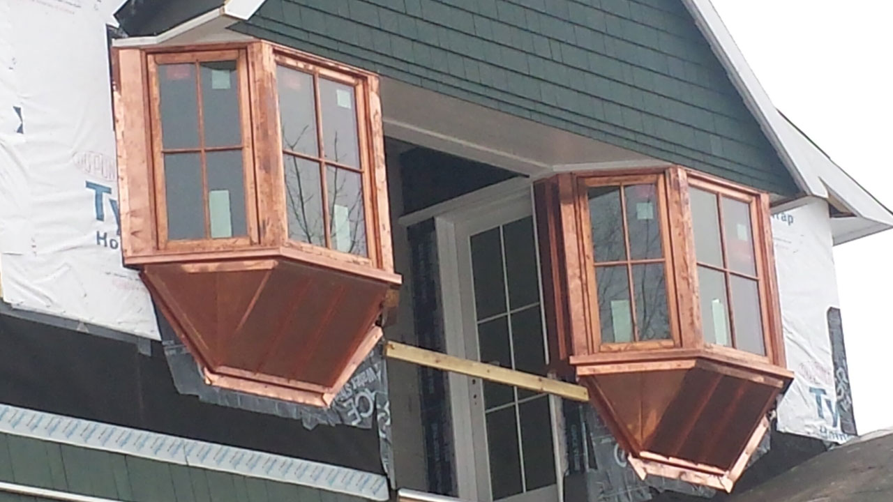 Copper facade, metal roofing installed by Norm's Roofing